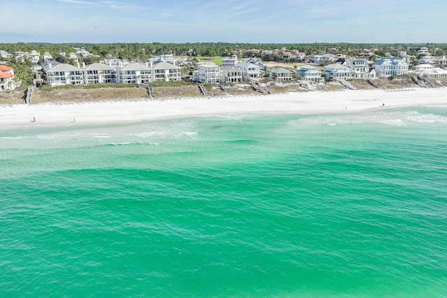 drone / aerial view with a water view and a view of the beach