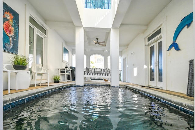 view of swimming pool with ceiling fan