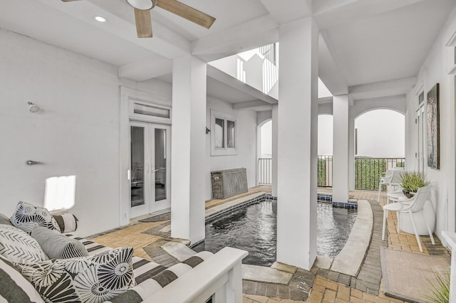 view of patio featuring french doors and ceiling fan