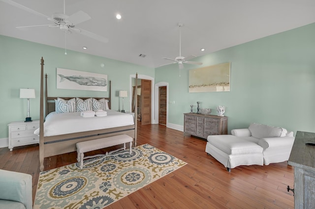 bedroom featuring hardwood / wood-style flooring and ceiling fan