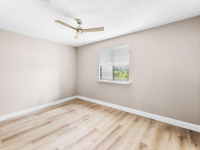 unfurnished room with light hardwood / wood-style floors and ceiling fan