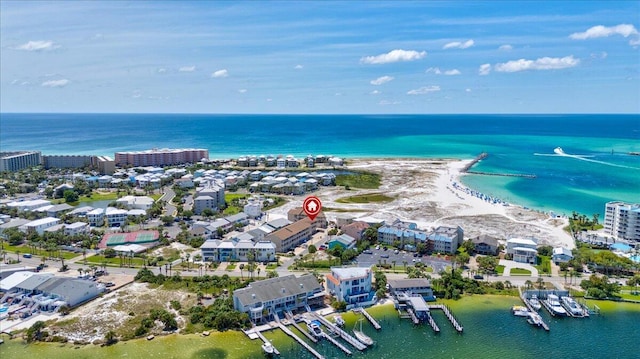 bird's eye view featuring a water view and a view of the beach