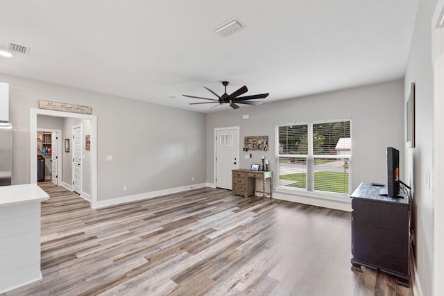 unfurnished living room with light hardwood / wood-style floors and ceiling fan