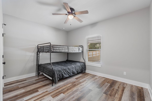 bedroom featuring hardwood / wood-style flooring and ceiling fan