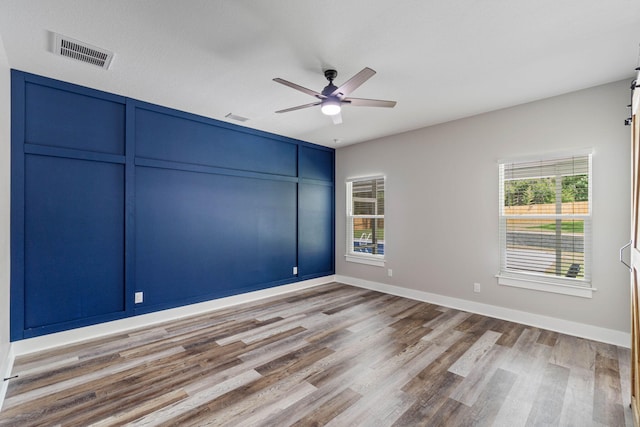 spare room featuring ceiling fan and wood-type flooring