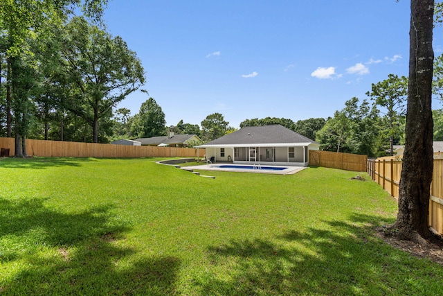 view of yard featuring a fenced in pool and a patio area