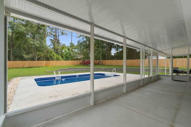 view of swimming pool featuring a lawn and a patio area