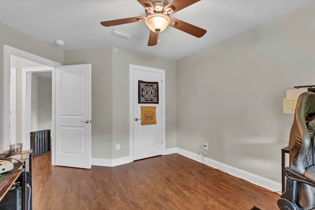 bedroom featuring dark hardwood / wood-style floors and ceiling fan