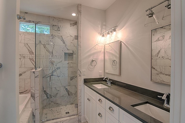 bathroom with vanity and separate shower and tub