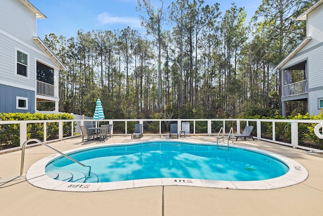 view of pool featuring a patio area