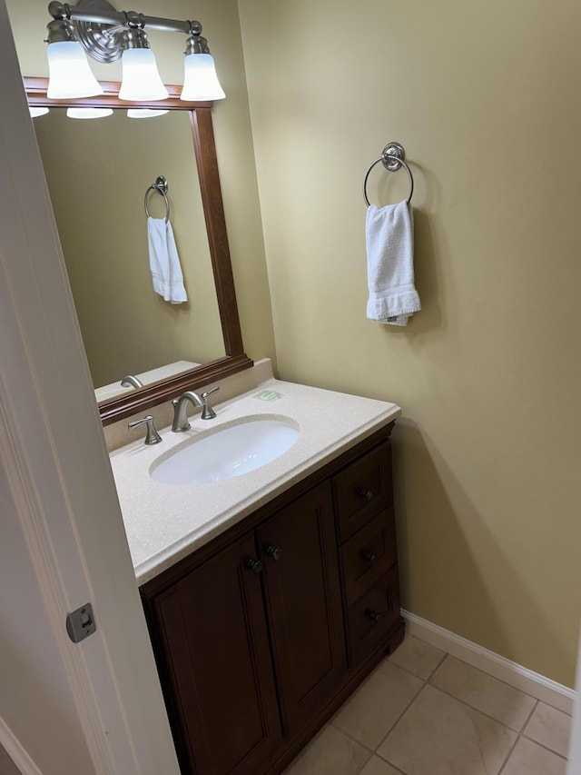 bathroom featuring tile patterned flooring and vanity