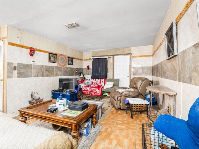 living room featuring tile walls