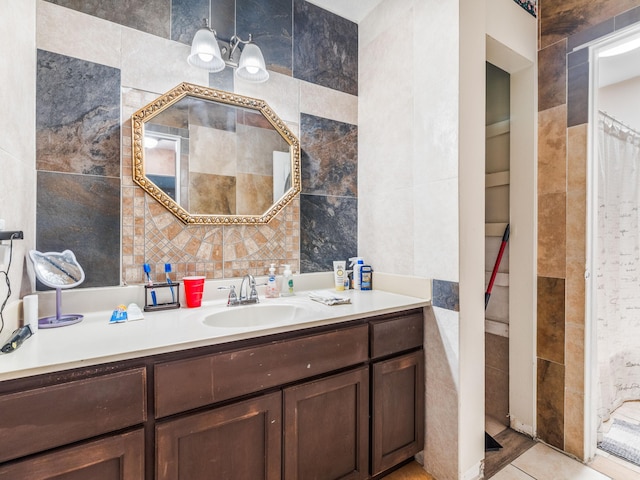 bathroom with vanity, tile walls, and tile patterned flooring