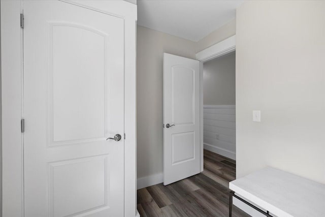 corridor featuring dark hardwood / wood-style floors