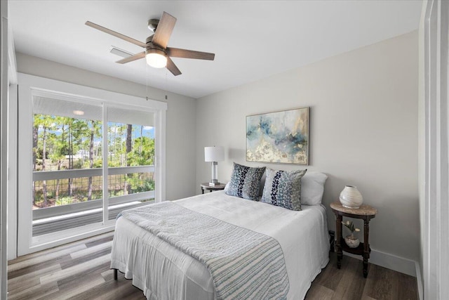 bedroom with wood-type flooring and ceiling fan