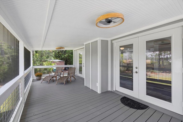 wooden deck featuring french doors