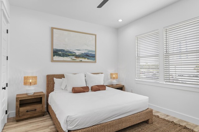 bedroom featuring light wood-type flooring and ceiling fan