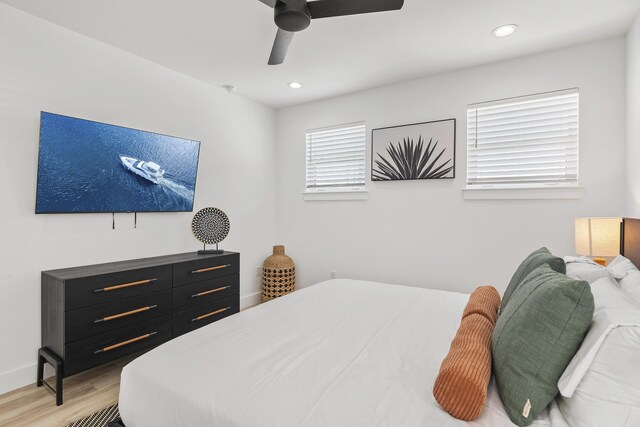 bedroom featuring light hardwood / wood-style floors and ceiling fan