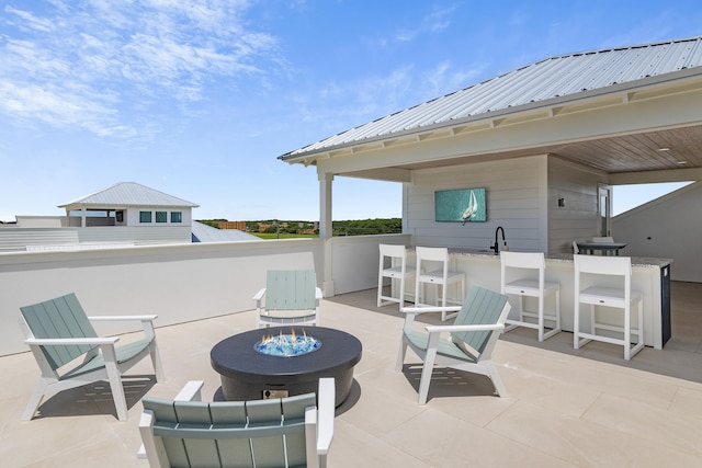 view of patio / terrace featuring a fire pit