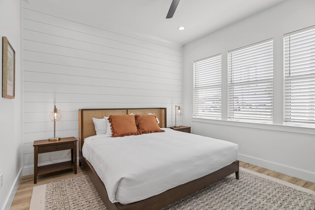 bedroom featuring light wood-type flooring and ceiling fan