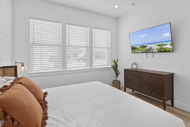 bedroom with hardwood / wood-style flooring