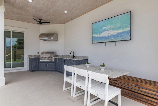 dining room with ceiling fan, sink, and wooden ceiling