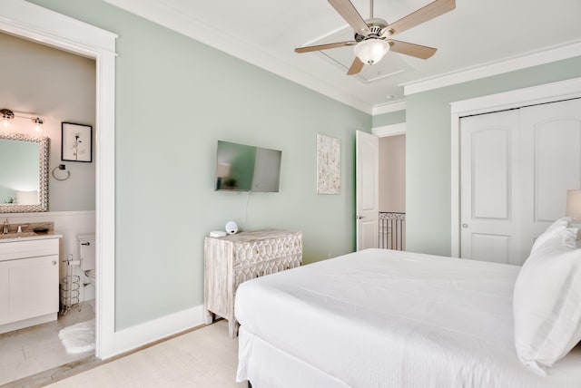 bedroom with a closet, ceiling fan, crown molding, and sink