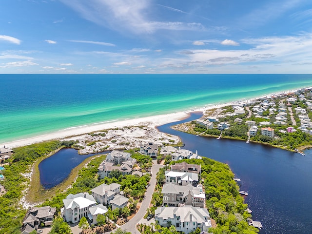 birds eye view of property featuring a water view and a view of the beach