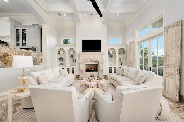 living room with french doors, coffered ceiling, crown molding, a towering ceiling, and beamed ceiling