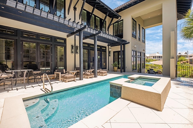 view of pool featuring a pergola, an in ground hot tub, and a patio