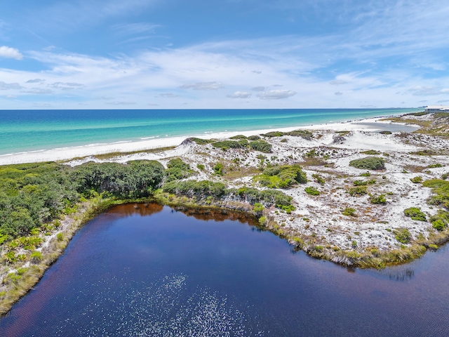 bird's eye view with a view of the beach and a water view