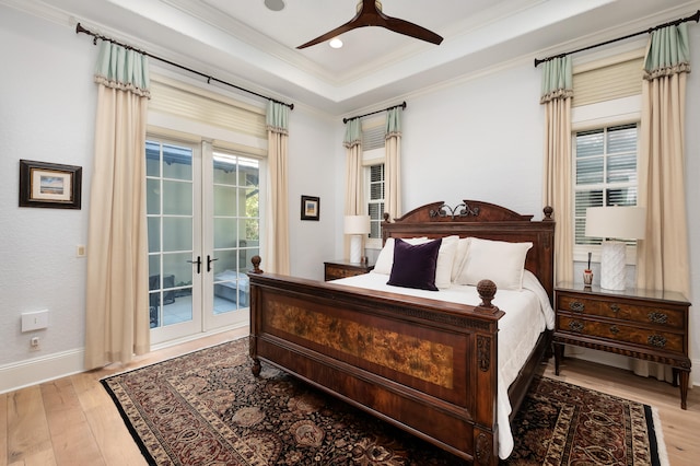 bedroom featuring access to exterior, light hardwood / wood-style floors, ceiling fan, and crown molding