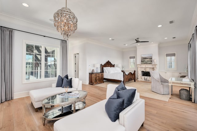 bedroom with a chandelier, light hardwood / wood-style floors, and ornamental molding