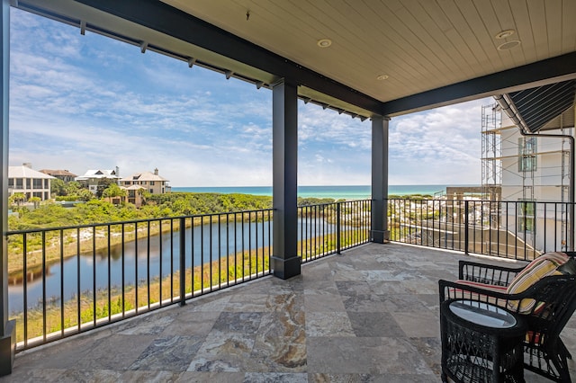 balcony featuring a water view