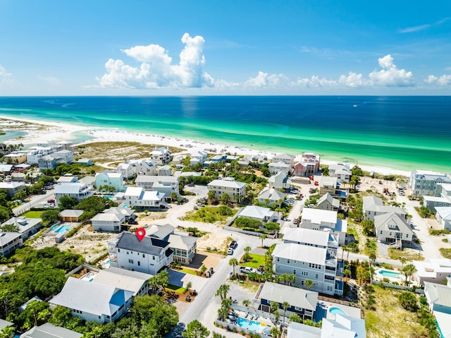 aerial view featuring a water view and a beach view