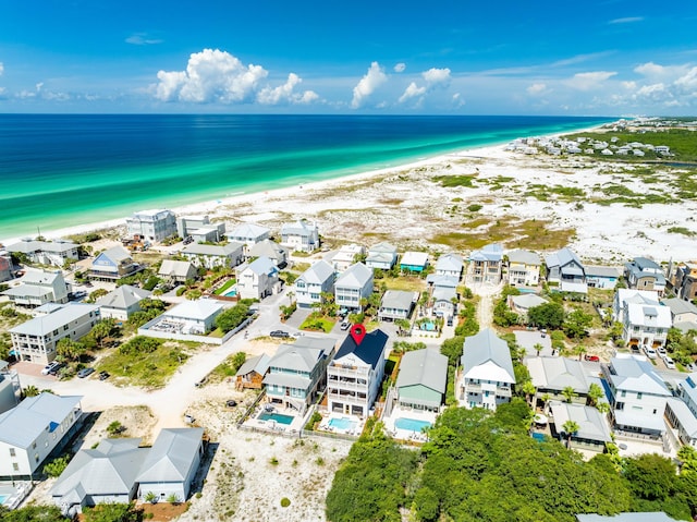 aerial view with a beach view and a water view