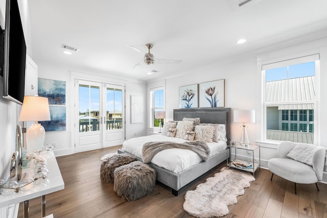 bedroom featuring access to outside, dark hardwood / wood-style floors, and ceiling fan