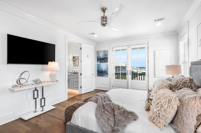 bedroom featuring ceiling fan, dark hardwood / wood-style floors, ensuite bathroom, ornamental molding, and access to outside