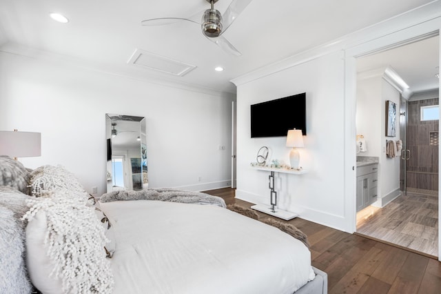 bedroom with ensuite bathroom, ornamental molding, dark wood-type flooring, and ceiling fan