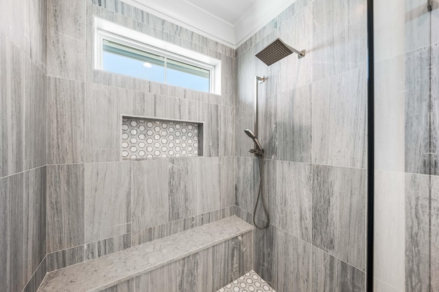 bathroom with a tile shower