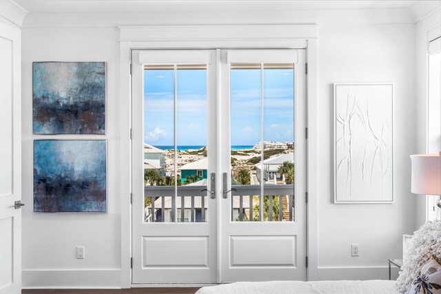 bedroom featuring crown molding, a closet, and multiple windows