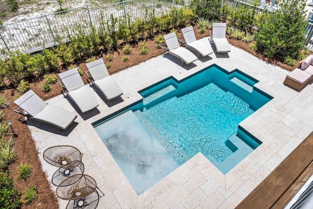 view of swimming pool with a patio