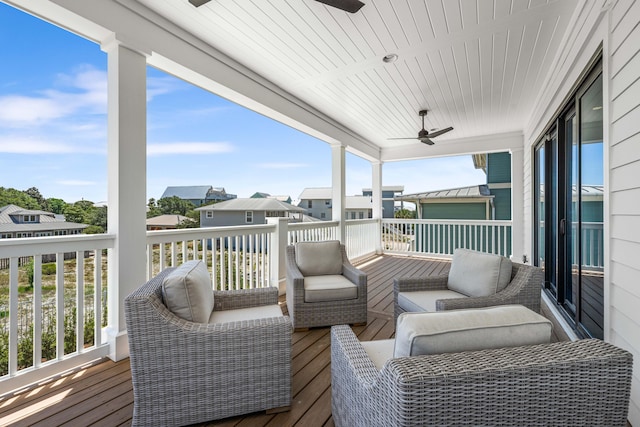 wooden deck featuring ceiling fan and an outdoor hangout area