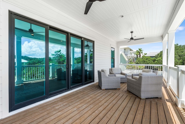 deck featuring outdoor lounge area and ceiling fan