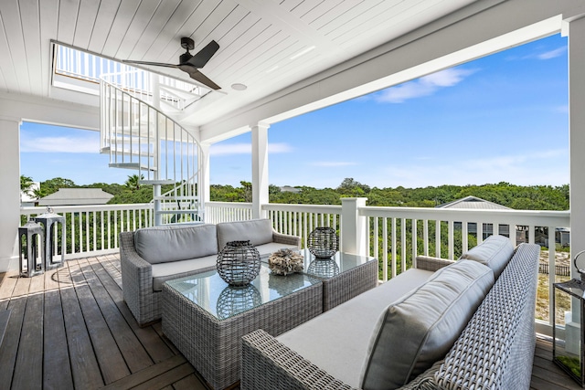 wooden deck featuring an outdoor hangout area and ceiling fan