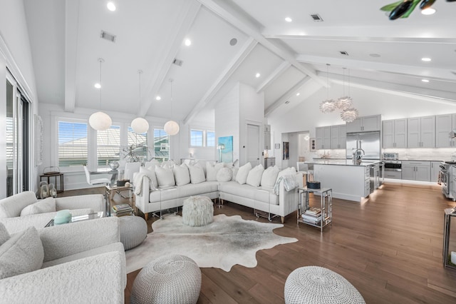 living room with high vaulted ceiling, dark hardwood / wood-style floors, and beamed ceiling