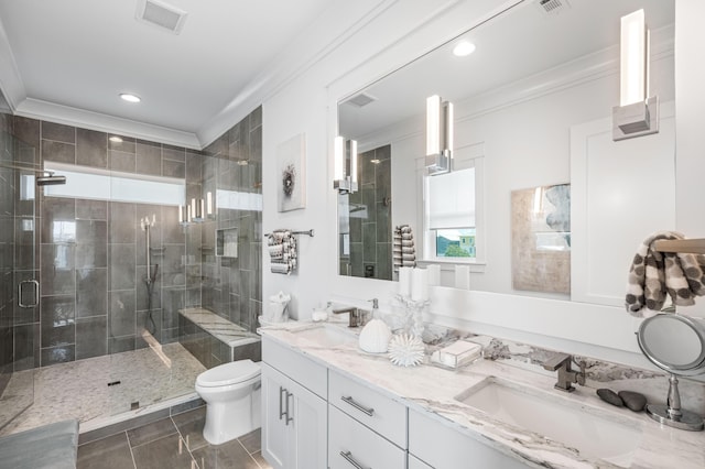 bathroom featuring an enclosed shower, vanity, ornamental molding, tile patterned floors, and toilet