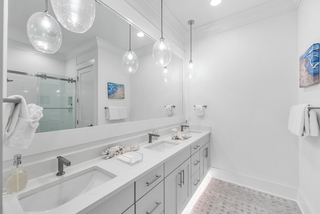 bathroom with vanity, ornamental molding, and a shower with door