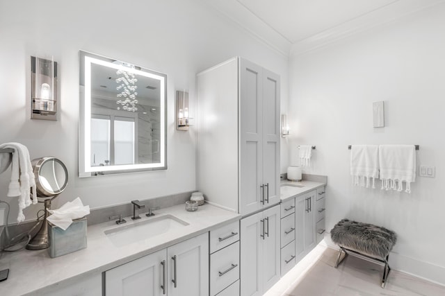 bathroom featuring ornamental molding and vanity