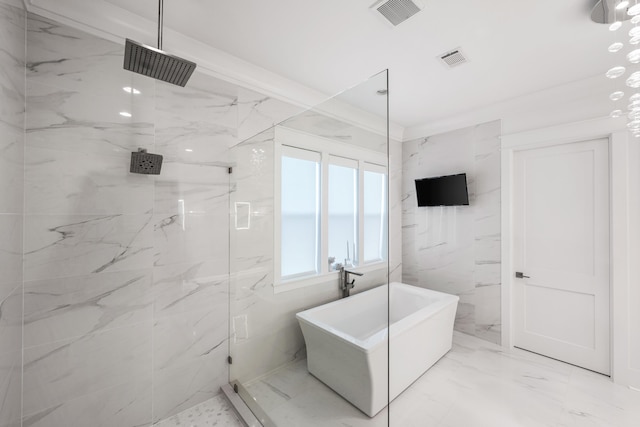 bathroom with ornamental molding and separate shower and tub